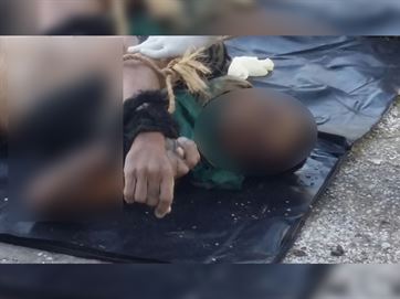 Corpo de homem foi achado com pés e mãos amarrados/Imagem compartilhada no WhatsApp 